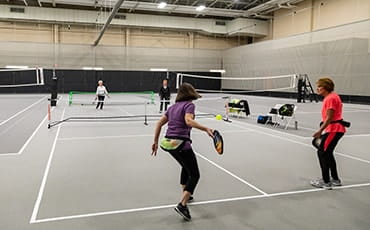 People playing pickleball